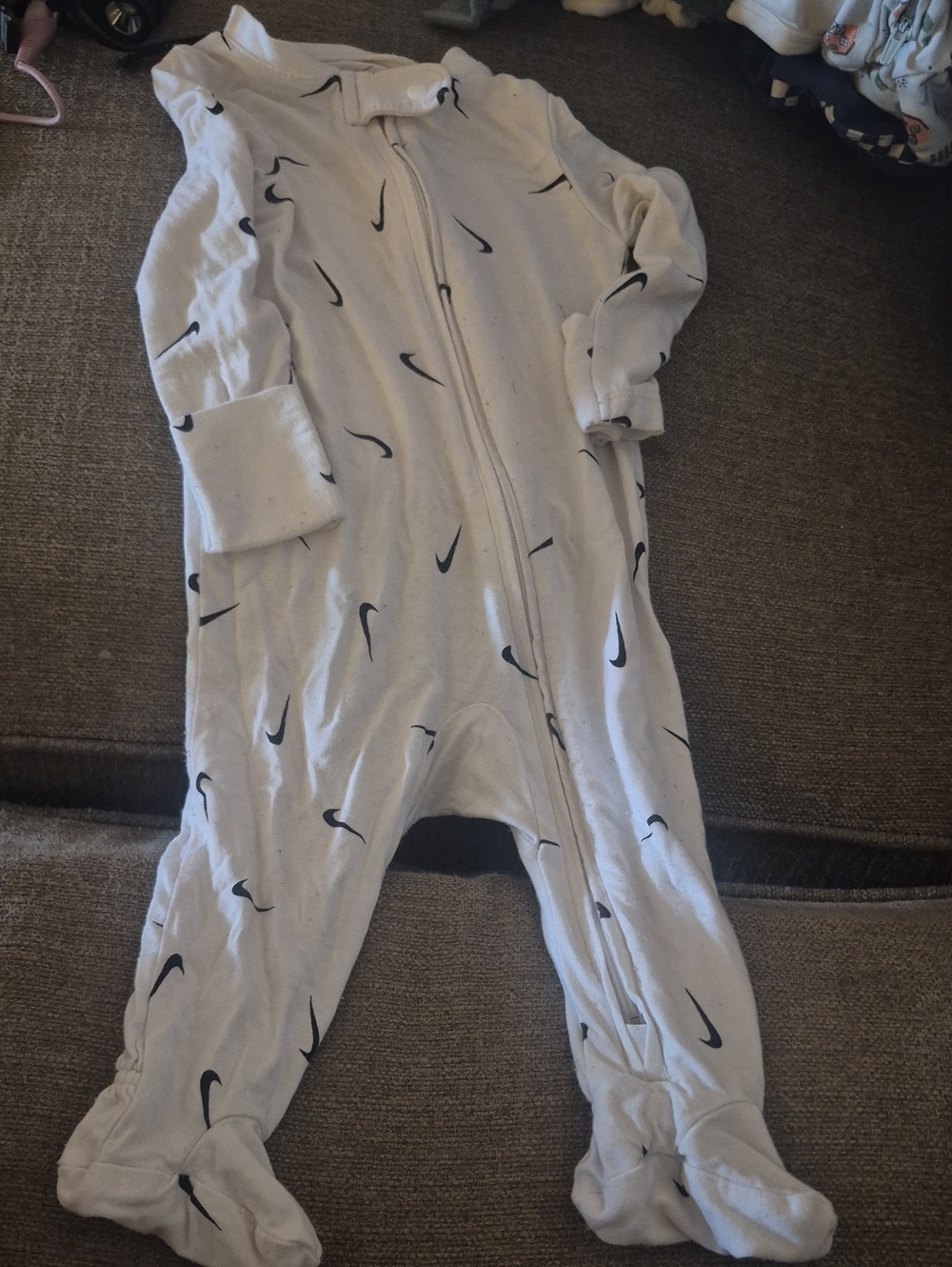 Nike White Footed Baby One-Piece with Black Swoosh Pattern